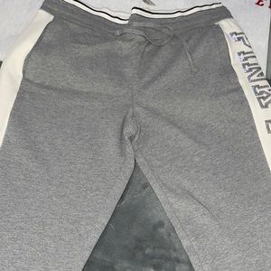 Pink sweatpants with sequins pink down on one side of the leg.NWT size L